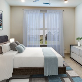 Spacious Bedroom recessed lighting and ceiling fan in carpeted bedroom in senior luxury apartments
