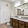 dual vanity sink with ample lighting in bathroom with walk-in closet in senior luxury apartments